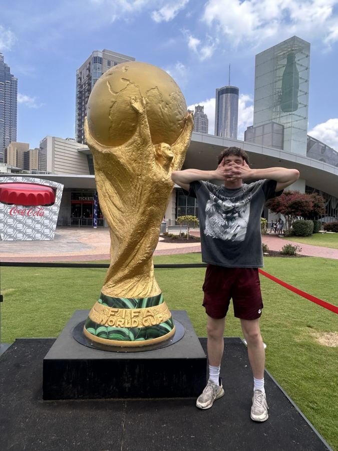 Ashton next to the World Cup trophy in Atlanta